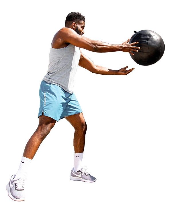 A fitness professional with a medicine ball.
