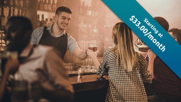 A bartender serves drinks with a smile, Bartender Business Insurance starting at $33.00/month.