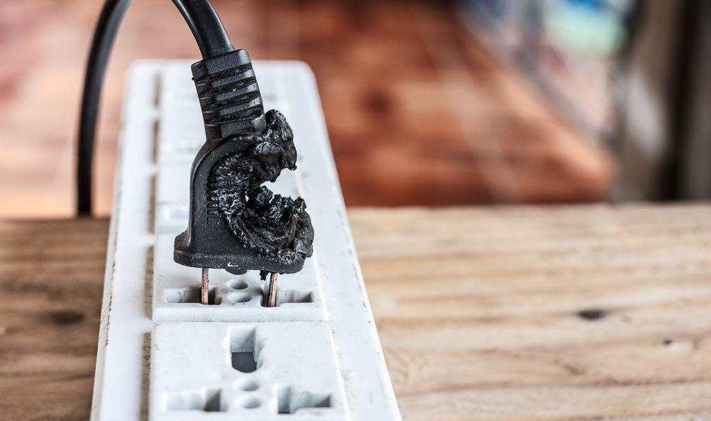 A burned plug in an outlet is the sign of a product that has worn out over the years of use and is at risk of causing a house fire. That kind of damage may be covered by a product liability insurance policy.