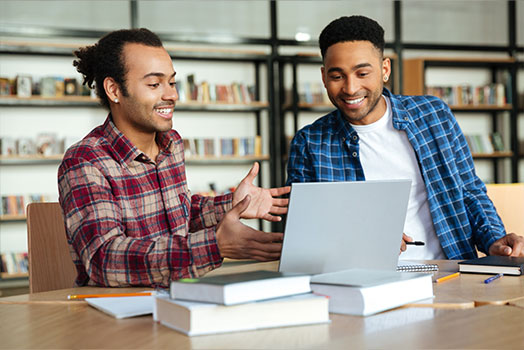 male tutor helping student