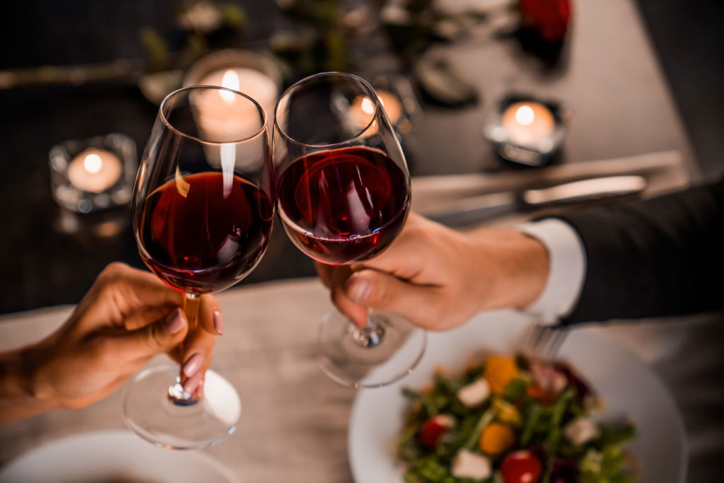 wine glass cheers at restaurant