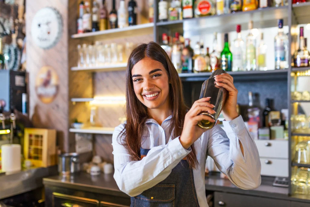 Bartender smiling with drink shaker