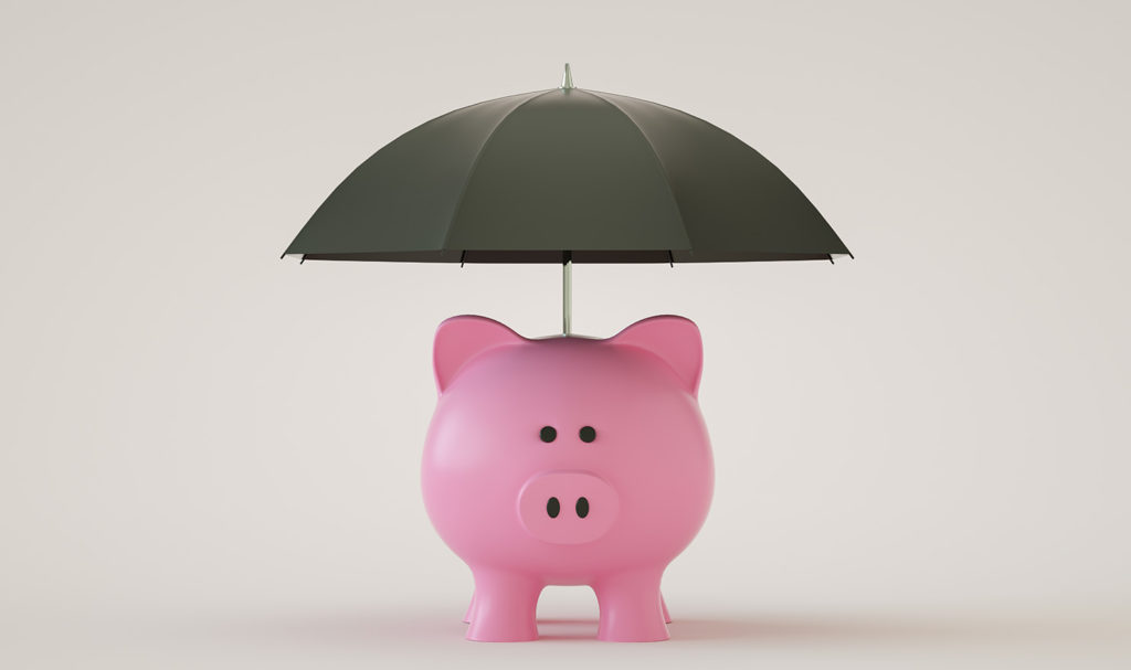 A small pink piggy bank stands under a black umbrella to represent product warranty.