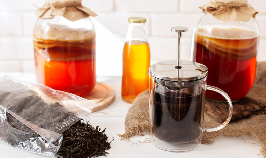 Containers of kombucha show the fermentation process the product goes through. Damages that may arise from this product may be protected by food manufacturing insurance.