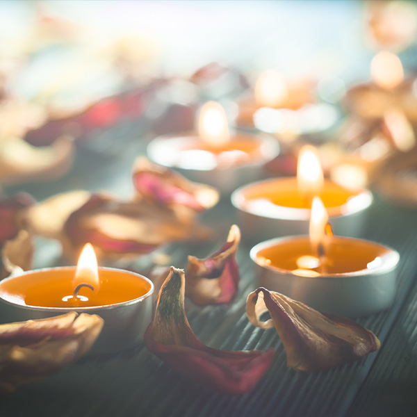 Mindful candles are lit for a peaceful yoga session.