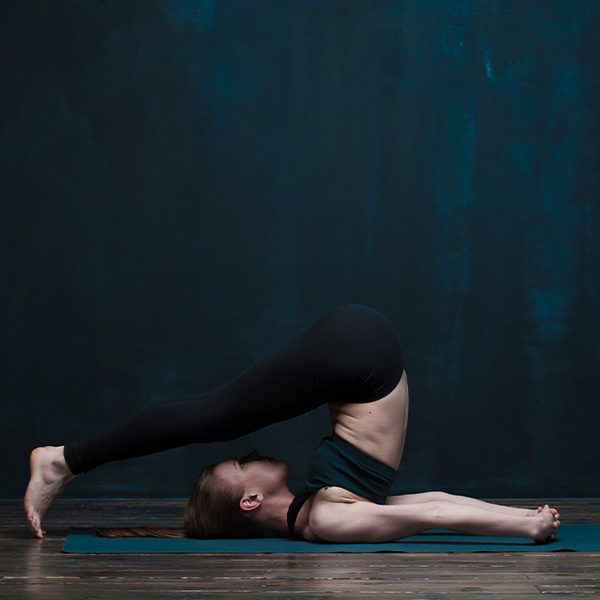 A yoga teacher works with confidence, insured with yoga teacher insurance from Insurance Canopy