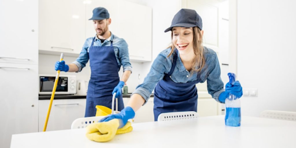 two people having a fun time cleaning