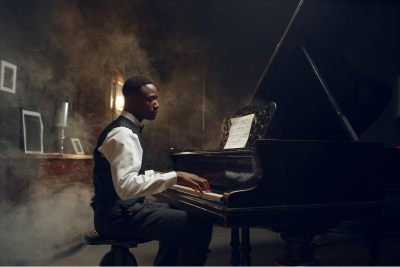 professional piano player at the piano surrounded by fog
