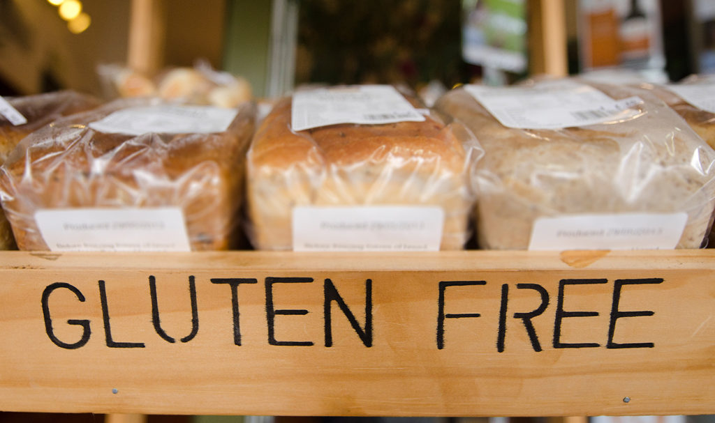 A box of bread that says Gluten Free in all caps across the front. Mislabeling and other packaging errors may be covered under food product liability insurance.