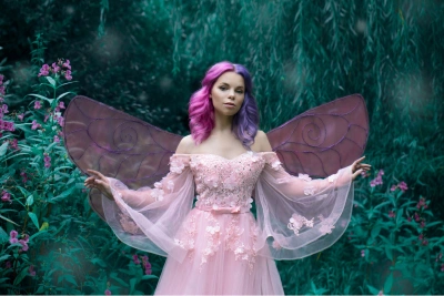 woman dressed as a fairy in the forrest