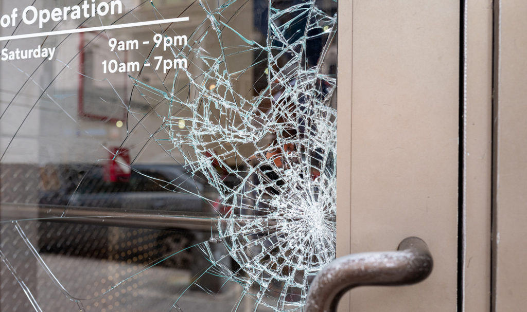 A close-up look at a shattered glass door.