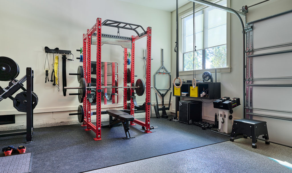 An at-home gym full of equipment.