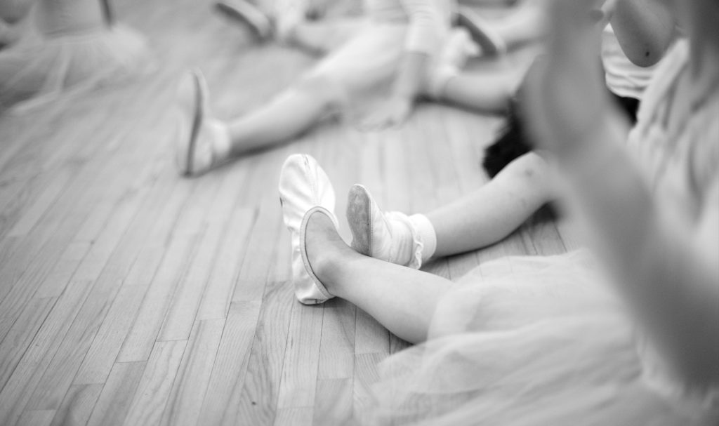 A shot of the costumes and shoes ballerinas wear in class.