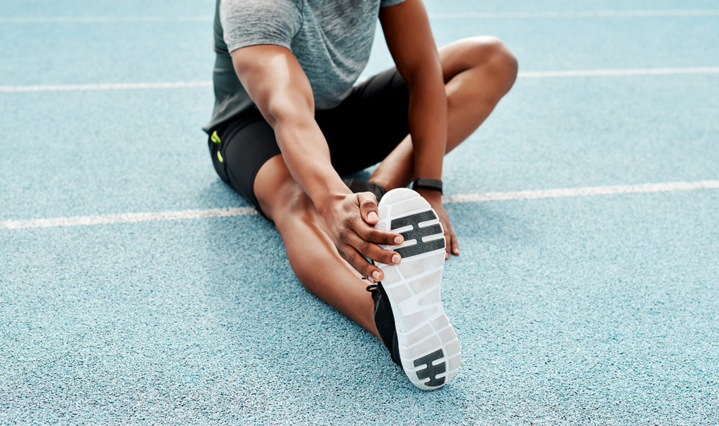 A runner is stretching before their workout.