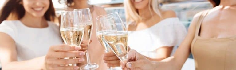 women cheers-ing with champagne