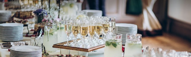 table setup for event with filled glasses of champagne