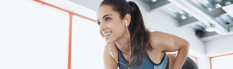 woman working out with headphones in