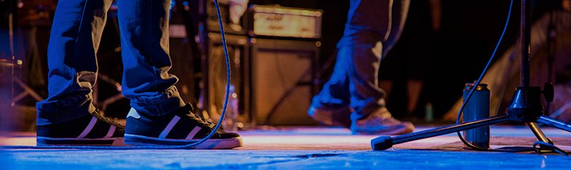 view of feet of band on stage