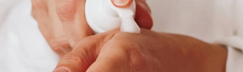 applying lotion to hands