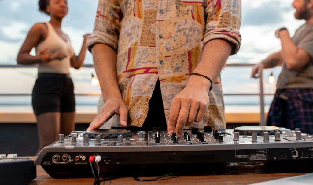 DJ mixing at outdoor party