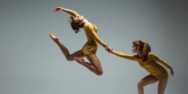 Two Dancers perform together.