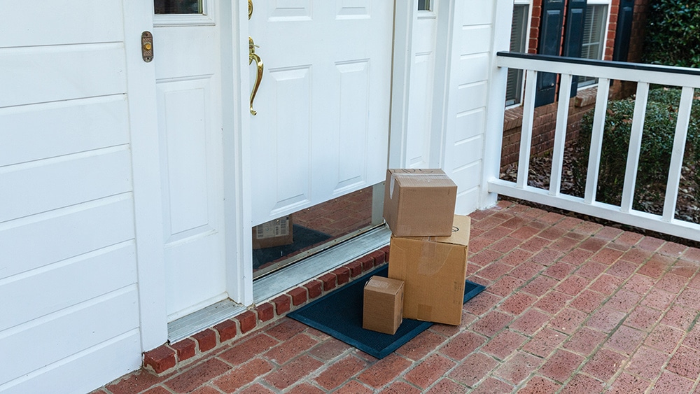3 amazon packages at someone's door