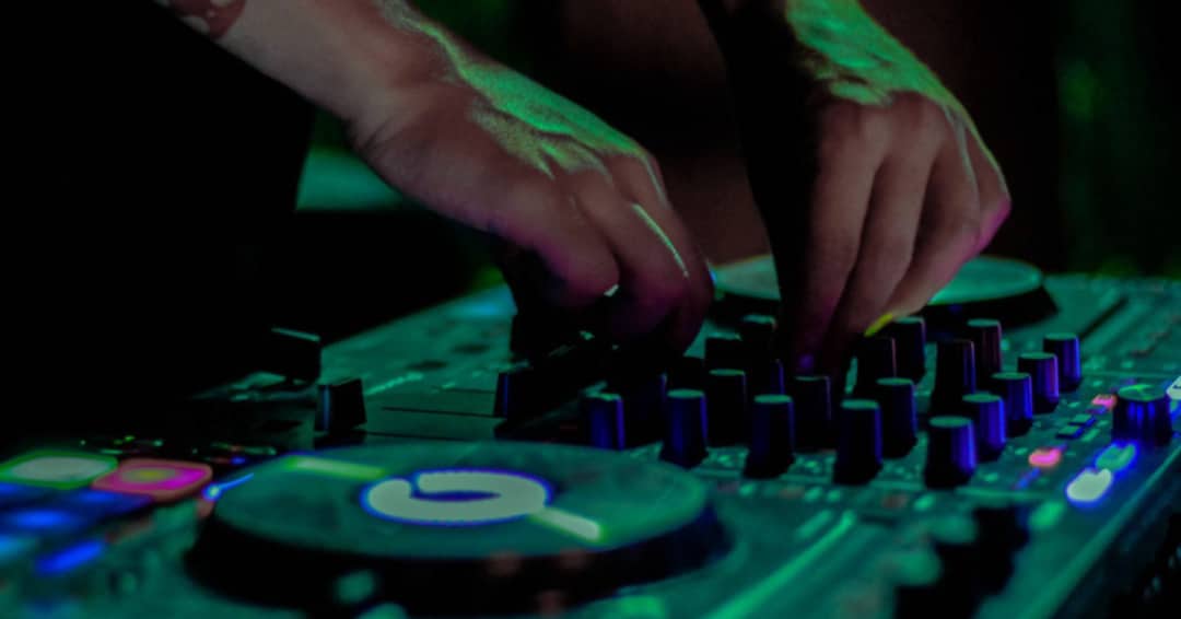 DJ mixing beats at event
