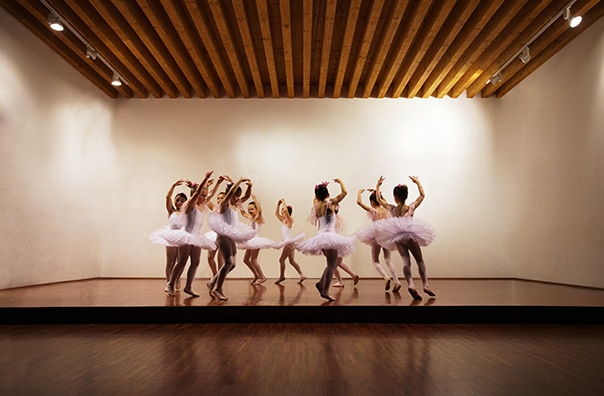 A ballet recital for young women goes well while the dance instructor carries dance instructor liability insurance